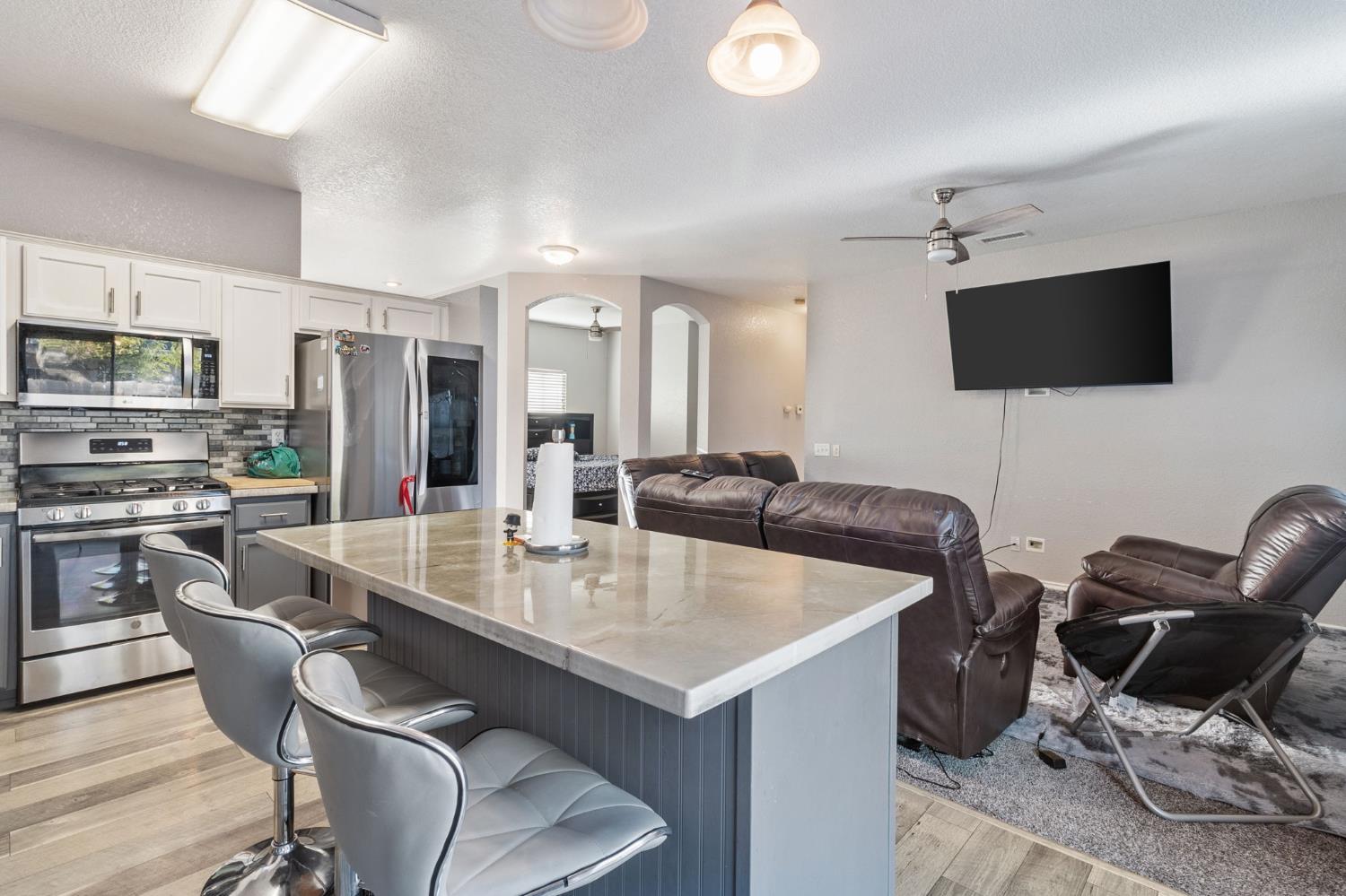 701 Palmer Place Atwater, CA 95301 - Photo 14 of 31 a view of kitchen with sink dining table and chairs