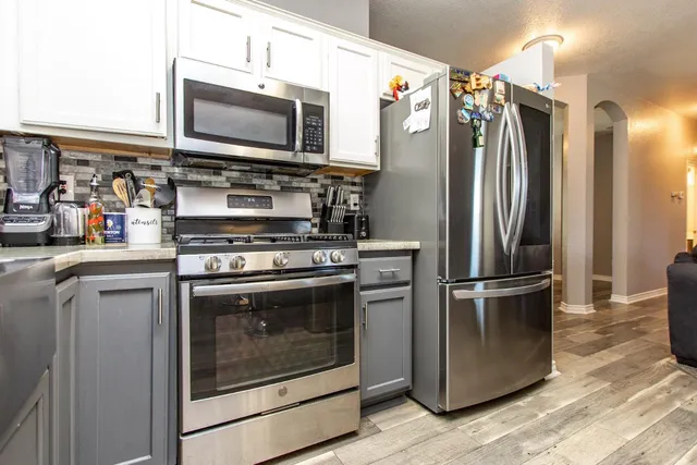 a bathroom with a double vanity sink mirror and shower