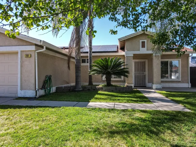 a living room with a furniture and a rug