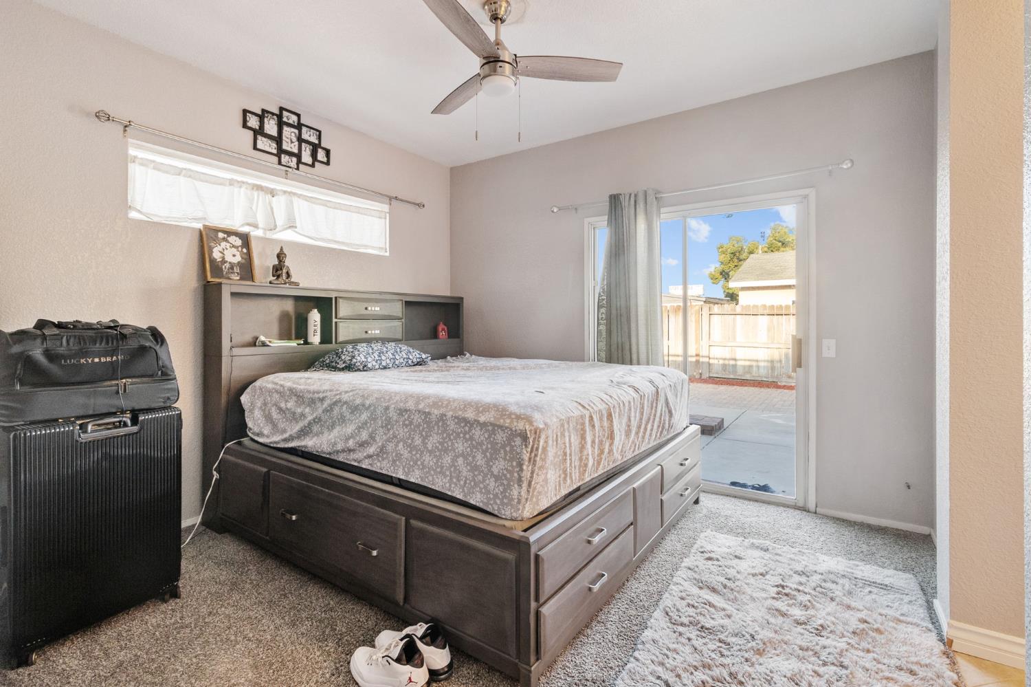 701 Palmer Place Atwater, CA 95301 - Photo 21 of 31 a bedroom with a bed and a dresser