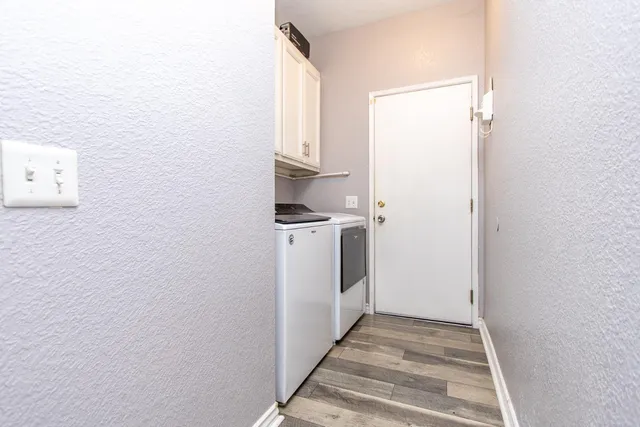 a white toilet sitting next to a shower