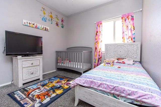 a bathroom with a granite countertop sink mirror and a bathtub