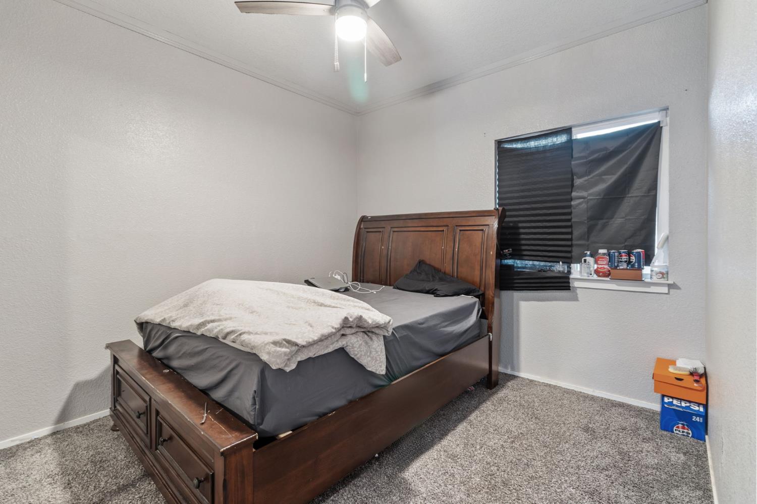 701 Palmer Place Atwater, CA 95301 - Photo 28 of 31 a bedroom with a bed and window