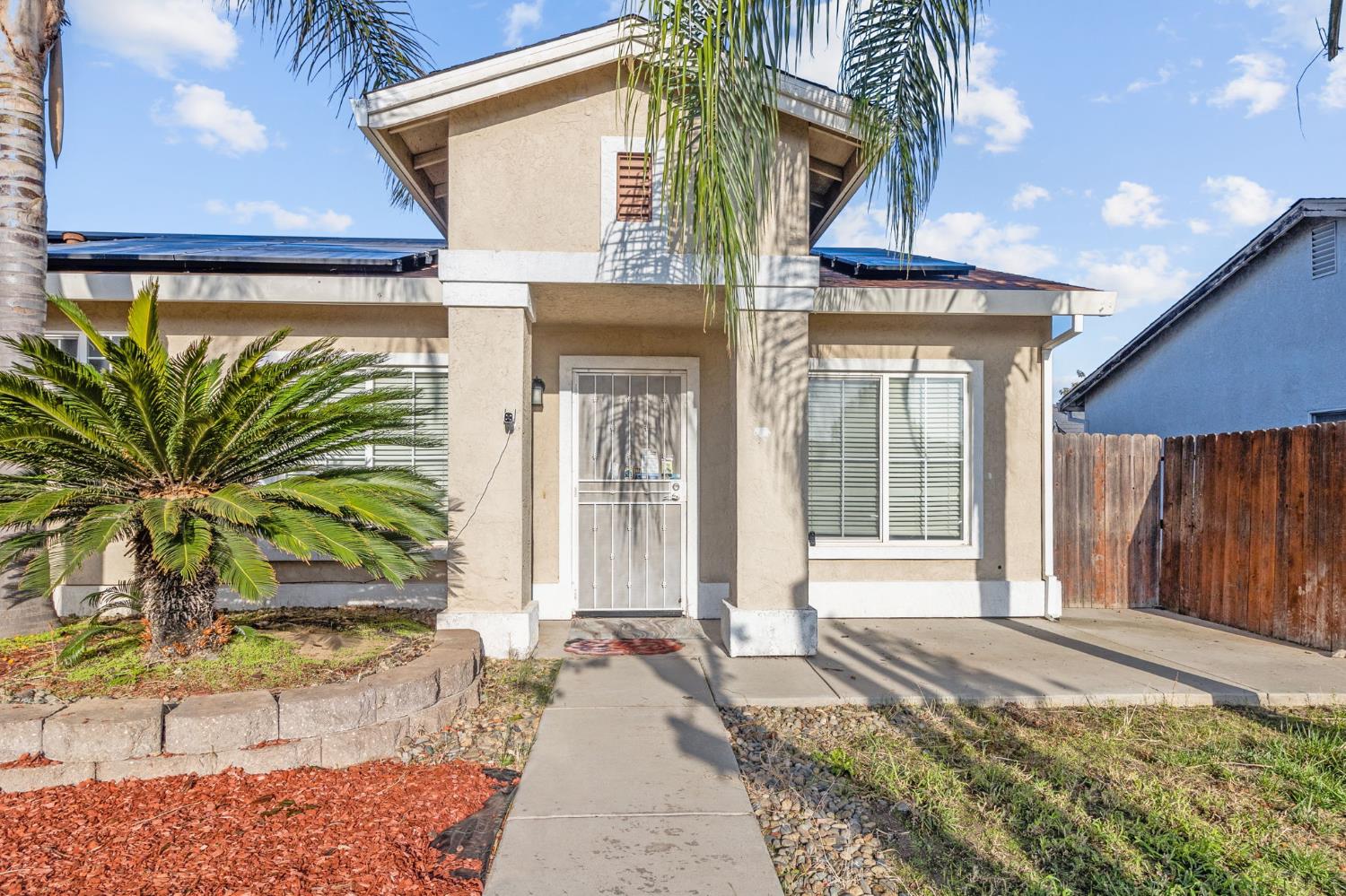 701 Palmer Place Atwater, CA 95301 - Photo 3 of 31 a front view of a house with a yard