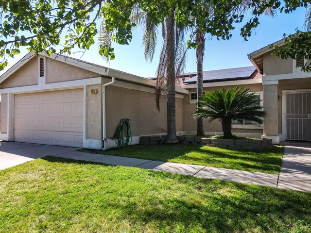 a bed room with a bed and a chair