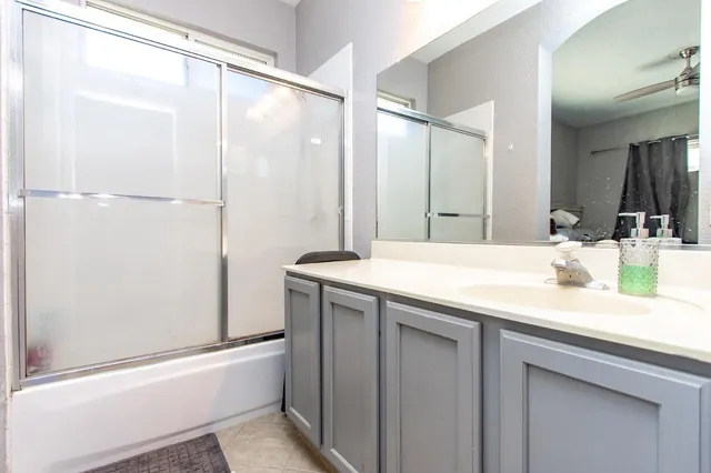 an aerial view of a house with a yard and garden