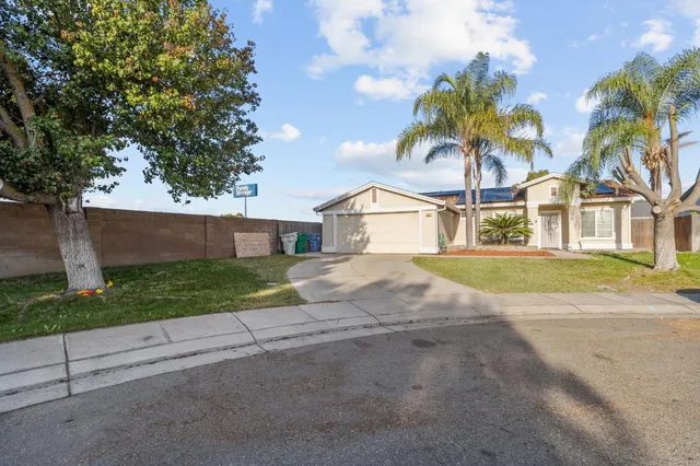 a view of house with outdoor space and tree s
