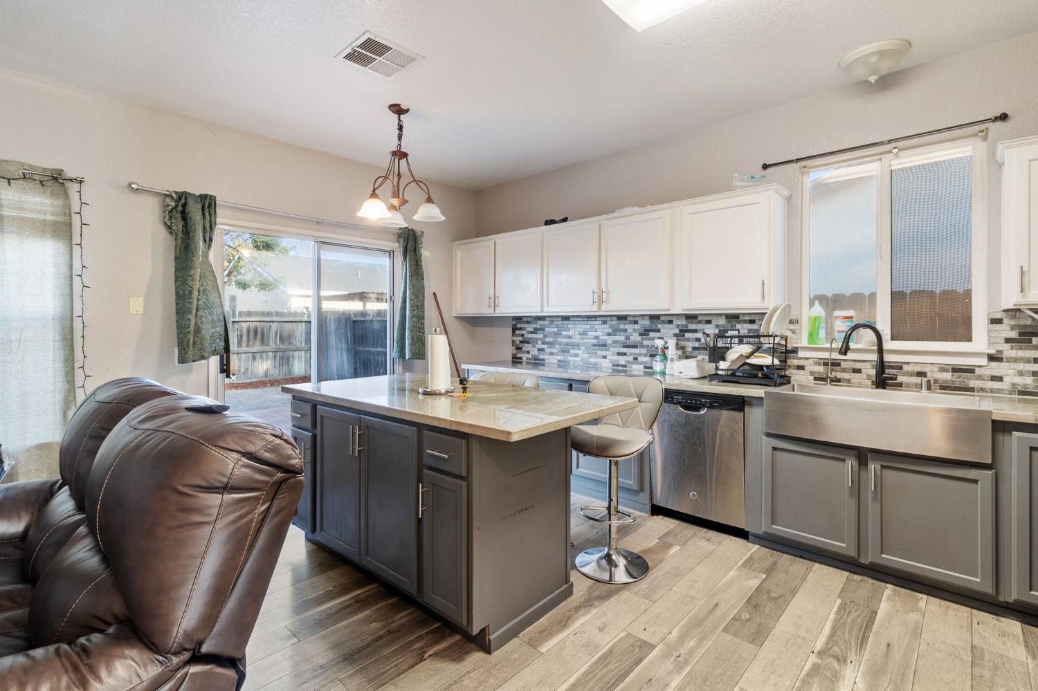 701 Palmer Place Atwater, CA 95301 - Photo 7 of 31 a kitchen with stainless steel appliances granite countertop a sink stove and refrigerator