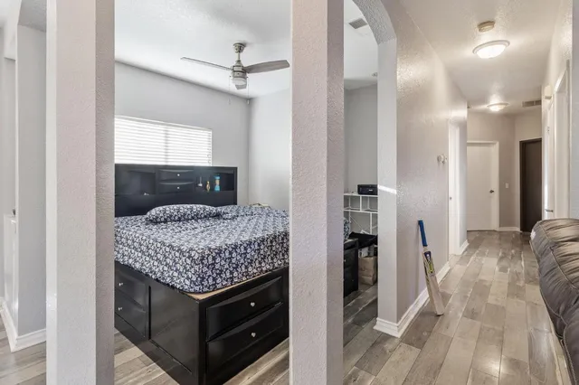 a bedroom with a bed and a couch