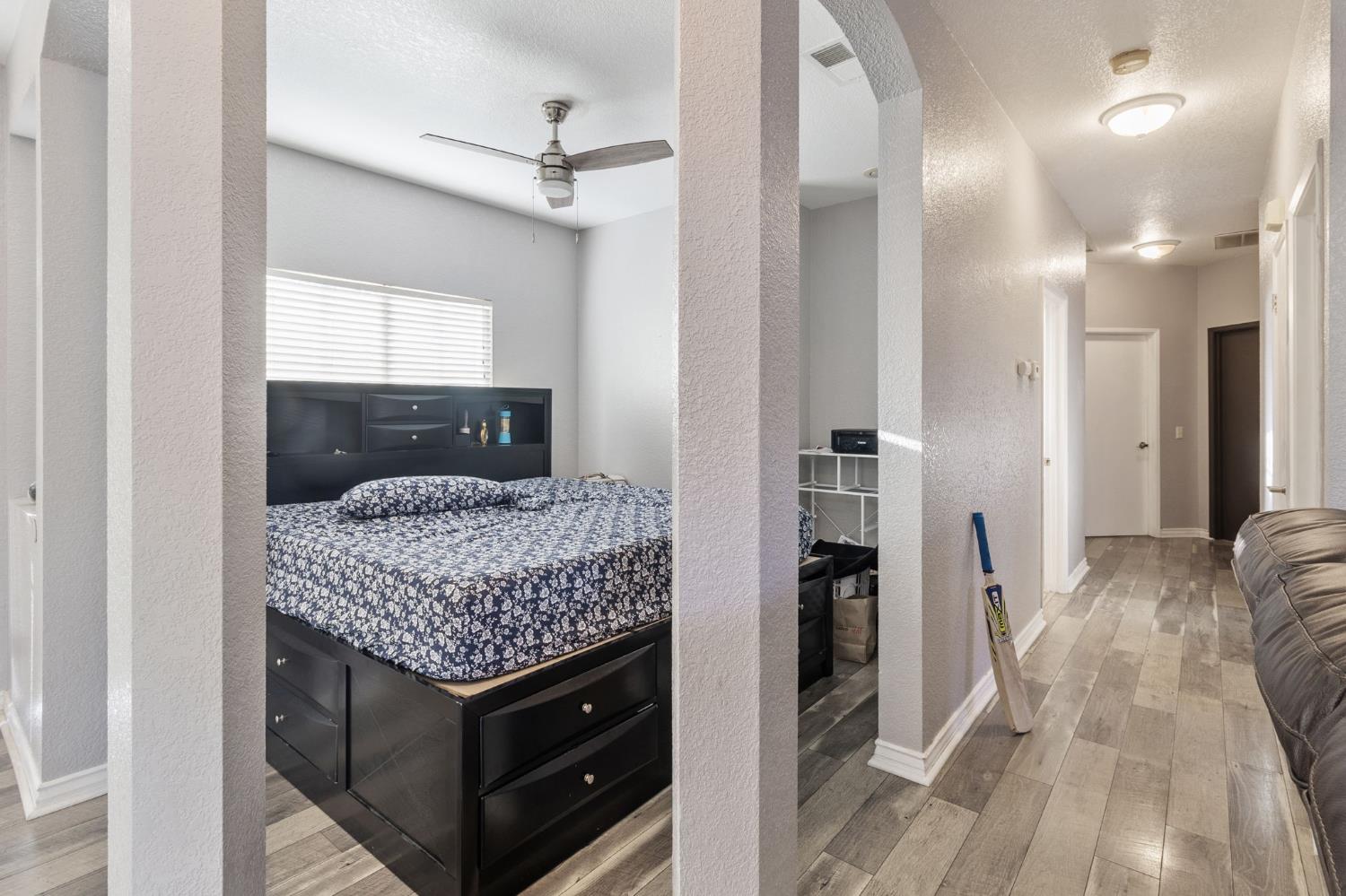 701 Palmer Place Atwater, CA 95301 - Photo 9 of 31 a bedroom with a bed and a couch