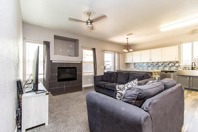 a kitchen with stainless steel appliances a refrigerator stove and microwave