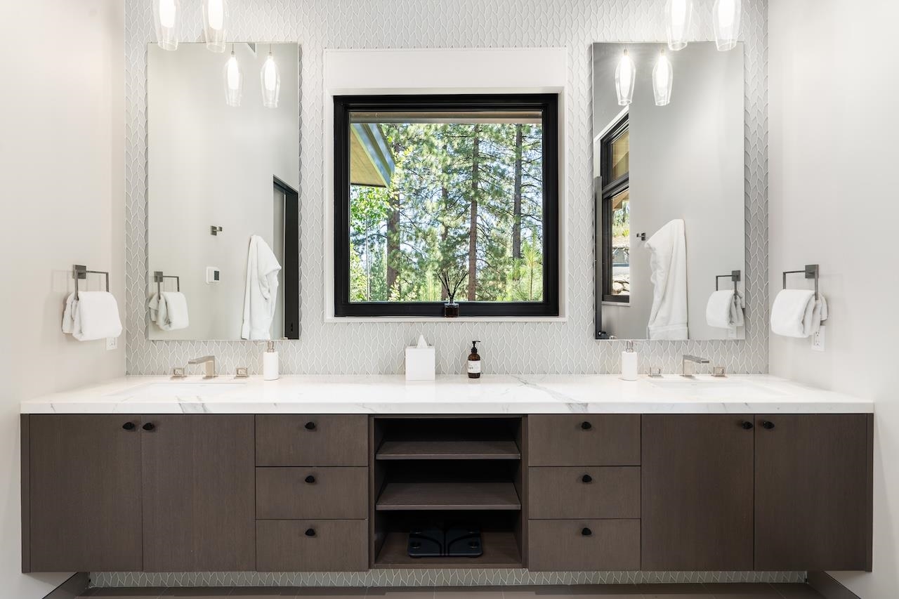 7745 Lahontan Drive Truckee, CA 96161 - Photo 11 of 28 a bathroom with a double vanity sink window and a mirror