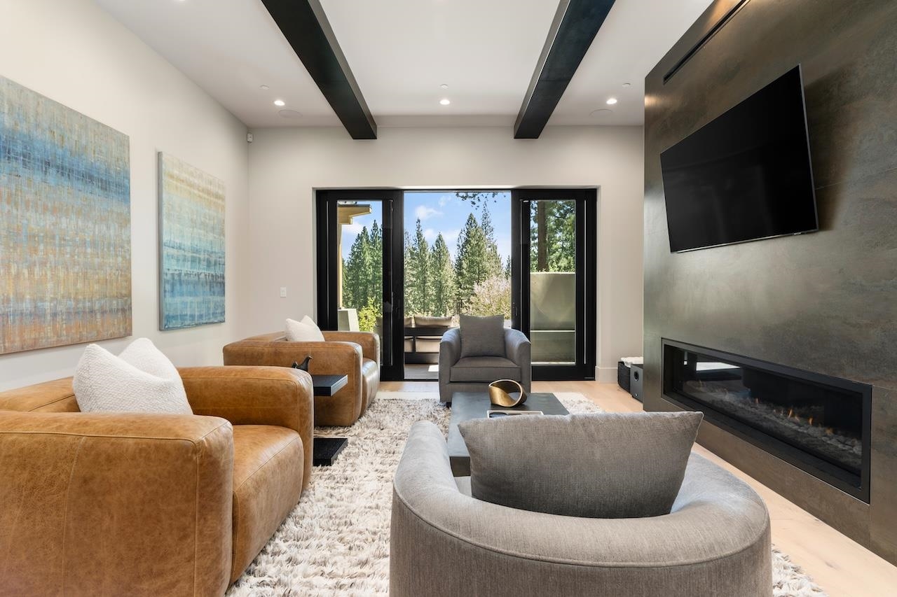 7745 Lahontan Drive Truckee, CA 96161 - Photo 13 of 28 a living room with couches and a flat screen tv