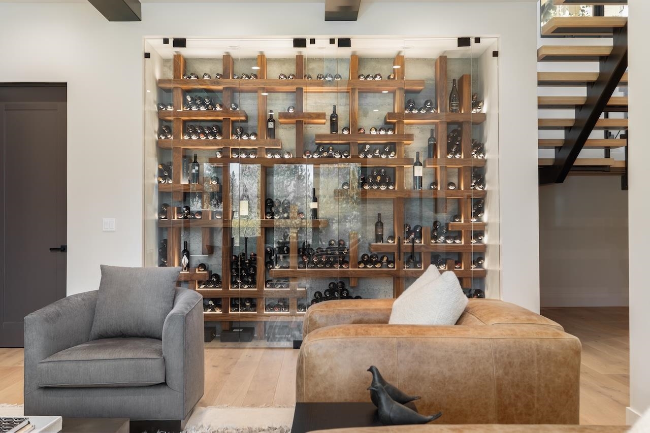 7745 Lahontan Drive Truckee, CA 96161 - Photo 15 of 28 a living room with furniture a rug and a chandelier