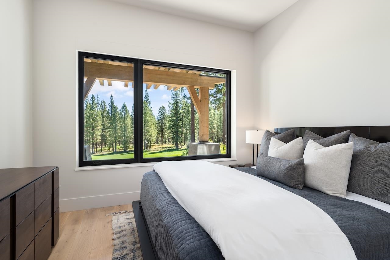 7745 Lahontan Drive Truckee, CA 96161 - Photo 20 of 28 a large bed sitting in a bedroom next to a window