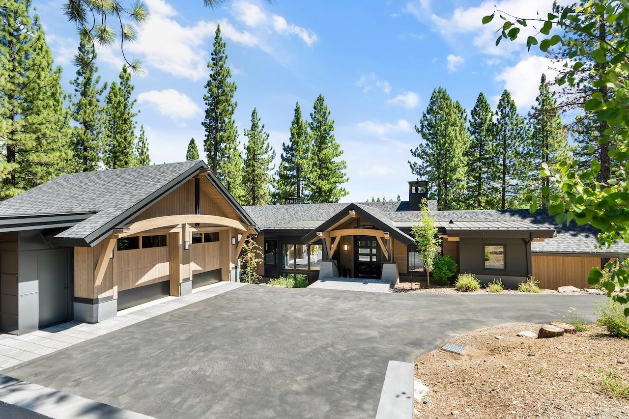 7745 Lahontan Drive Truckee, CA 96161 - Photo 2 of 28 a front view of a house with a yard and trees