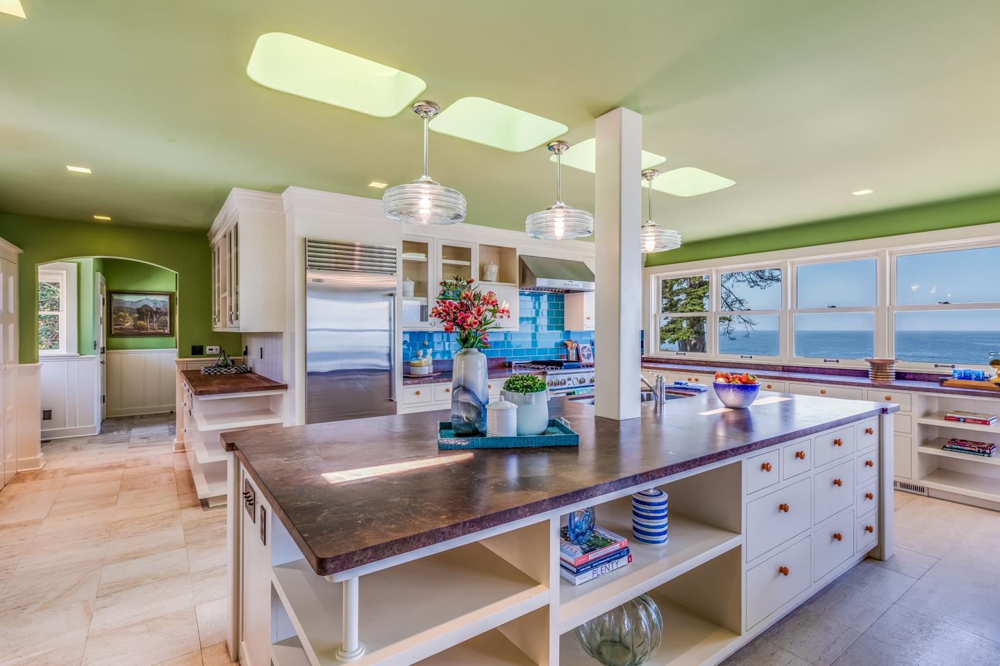 28 Cresta Way La Selva Beach, CA 95076 - Photo 17 of 39 a kitchen with stainless steel appliances kitchen island granite countertop a table and chairs in it