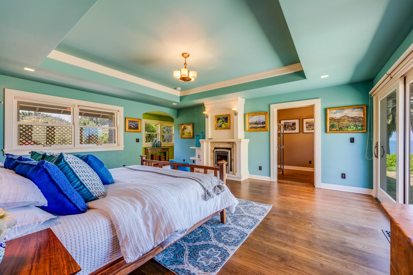 28 Cresta Way La Selva Beach, CA 95076 - Photo 30 of 39 a spacious bedroom with a large bed a chandelier and windows