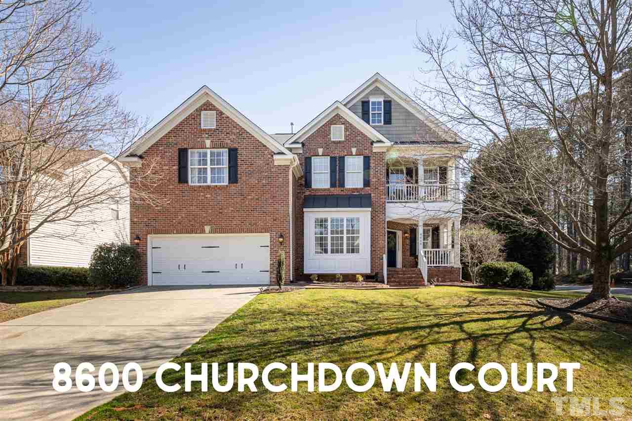 8600 Churchdown Court Raleigh, NC 27613 - Photo 1 of 29 a front view of a house with a yard