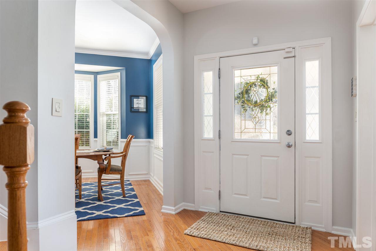 8600 Churchdown Court Raleigh, NC 27613 - Photo 3 of 29 a living room with furniture and a window