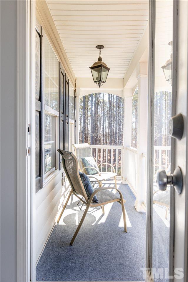 8600 Churchdown Court Raleigh, NC 27613 - Photo 24 of 29 a view of a room with balcony and furniture