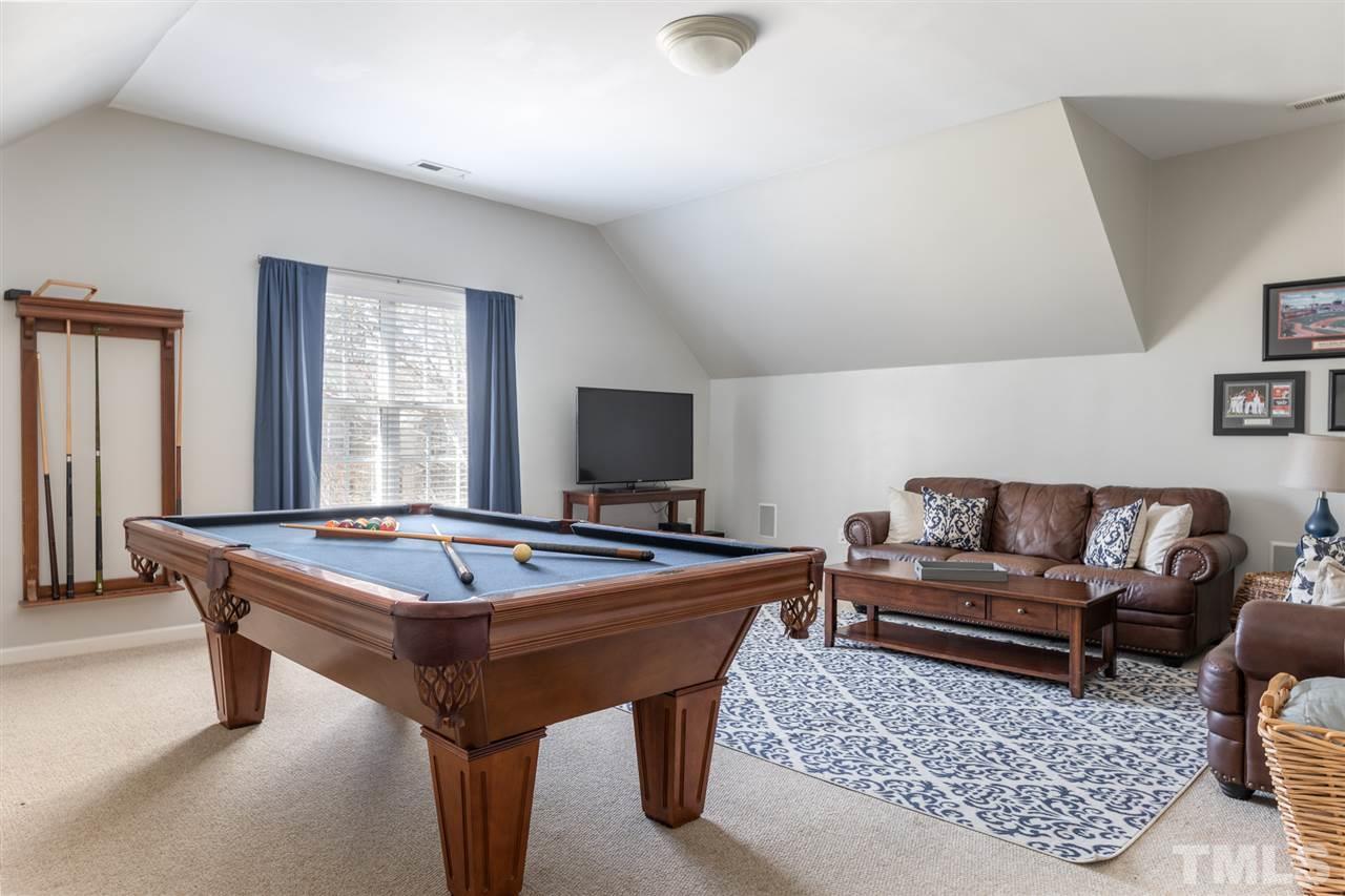 8600 Churchdown Court Raleigh, NC 27613 - Photo 25 of 29 a room with furniture pool table and windows
