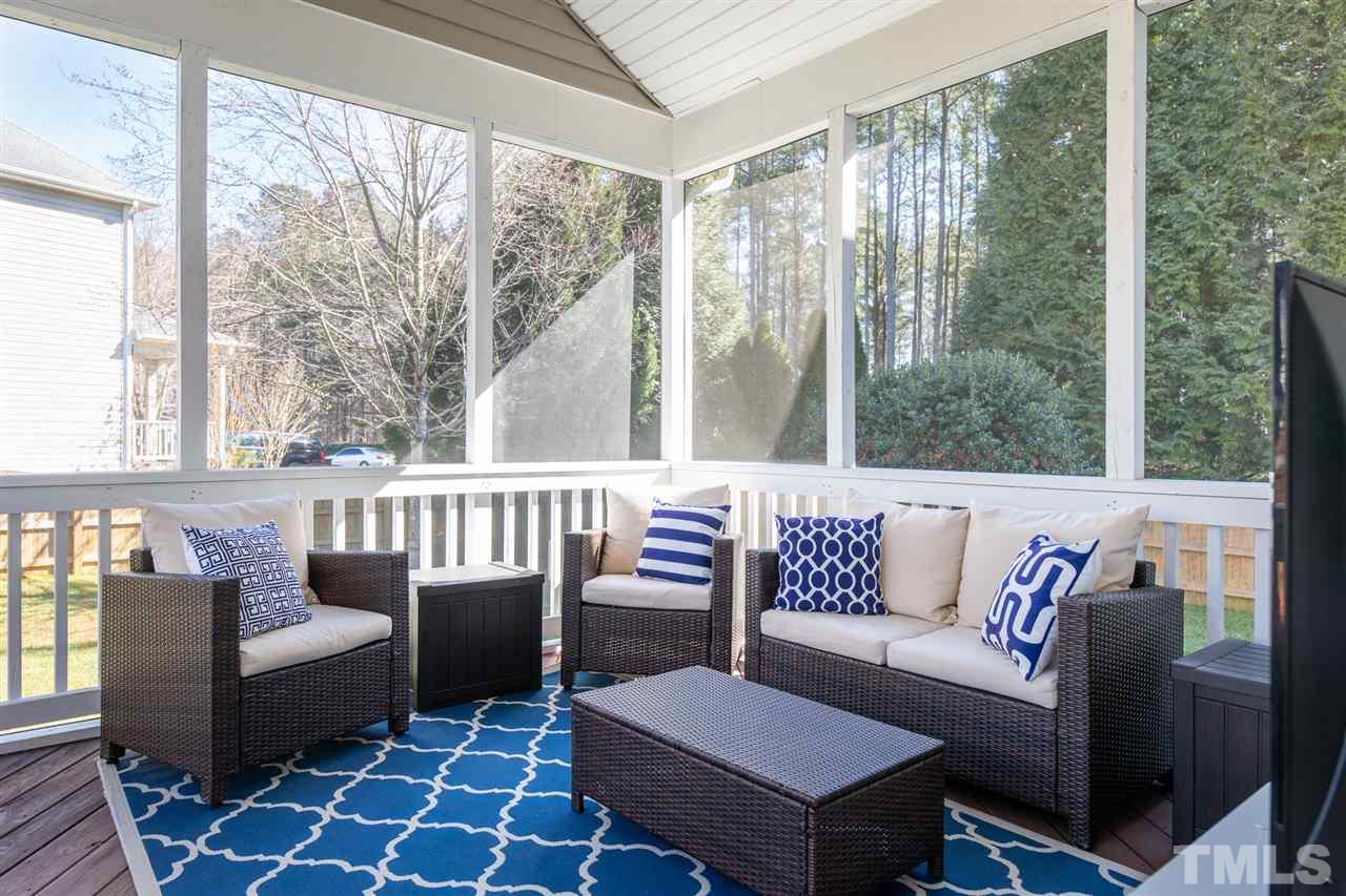 8600 Churchdown Court Raleigh, NC 27613 - Photo 27 of 29 a outdoor living room with furniture and a large window