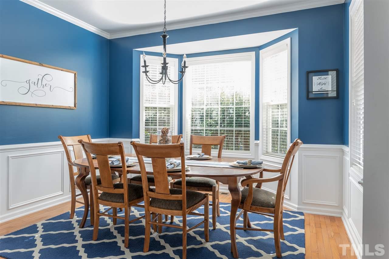 8600 Churchdown Court Raleigh, NC 27613 - Photo 6 of 29 a view of a dining room with furniture window and outside view