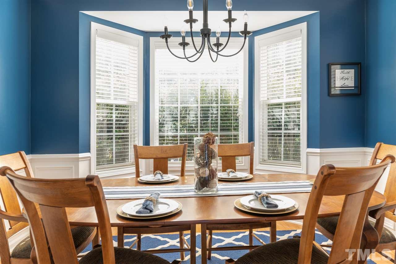 8600 Churchdown Court Raleigh, NC 27613 - Photo 7 of 29 a view of a dining room with furniture window and outside view