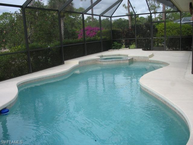 117 Muirfield Circle Naples, FL 34113 - Photo 11 of 12 a view of a backyard