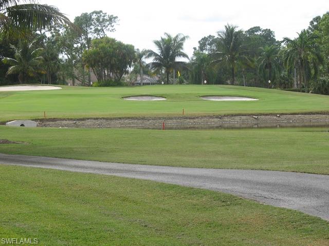 117 Muirfield Circle Naples, FL 34113 - Photo 12 of 12 a view of a golf course