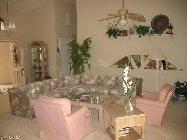 117 Muirfield Circle Naples, FL 34113 - Photo 2 of 12 a view of a dining room with furniture