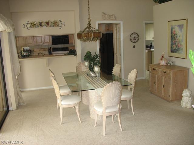 117 Muirfield Circle Naples, FL 34113 - Photo 5 of 12 a dining room with furniture and window