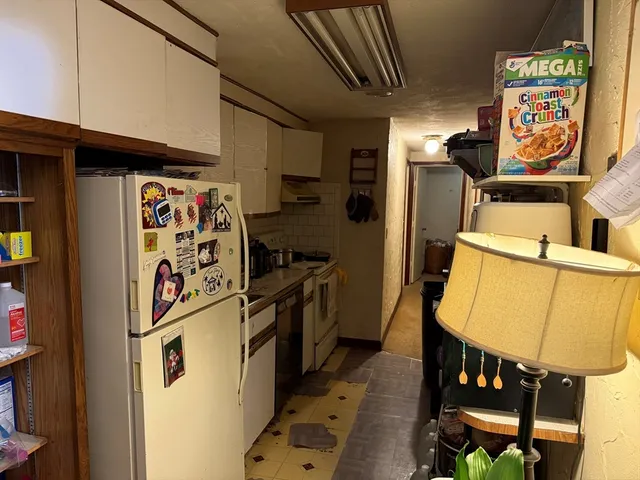 walk in closet with wooden floor
