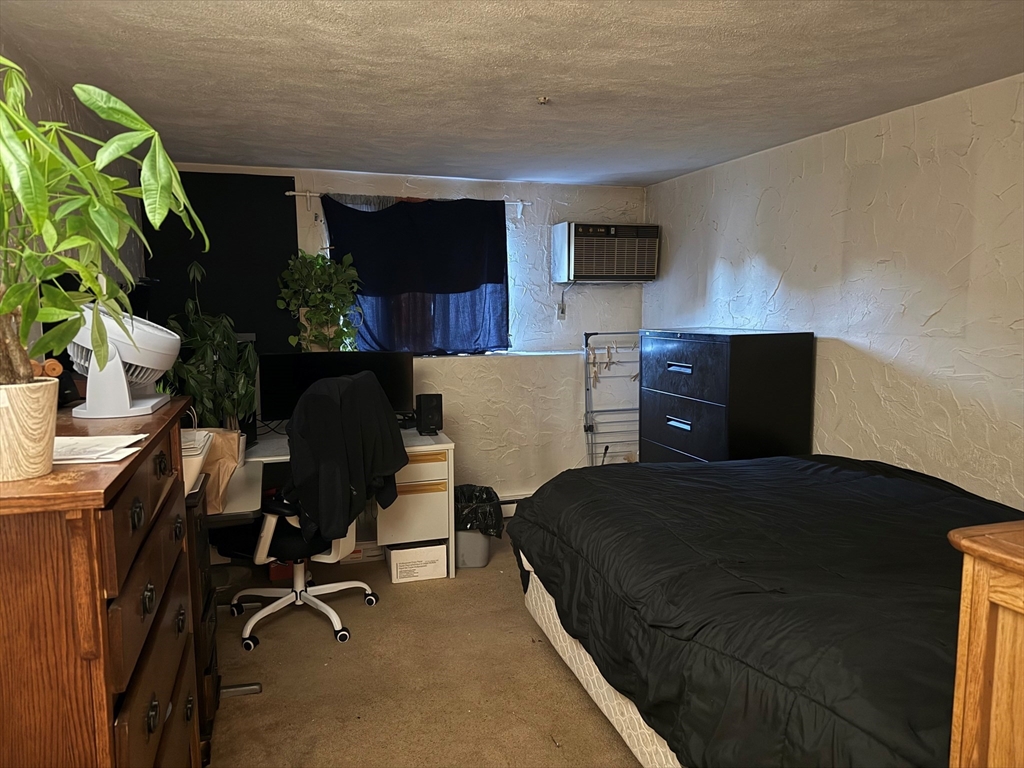 220 Swanson Road, Unit 604 Boxborough, MA 01719 - Photo 7 of 7 a bedroom with a workspace