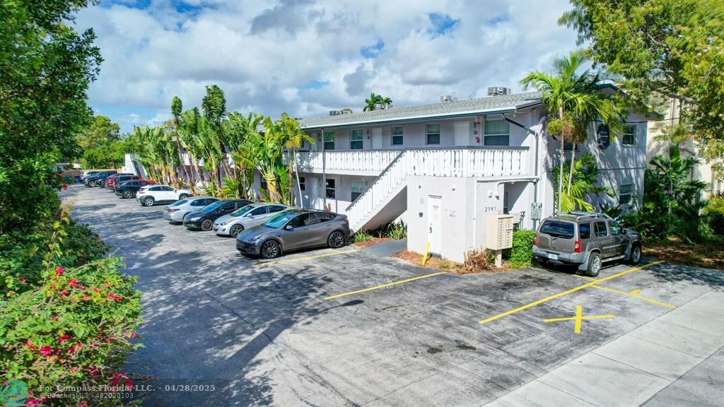 2741 Northeast 8th Avenue, Unit 15 Wilton Manors, FL 33334 - Photo 21 of 46 a view of a house with a yard and sitting area