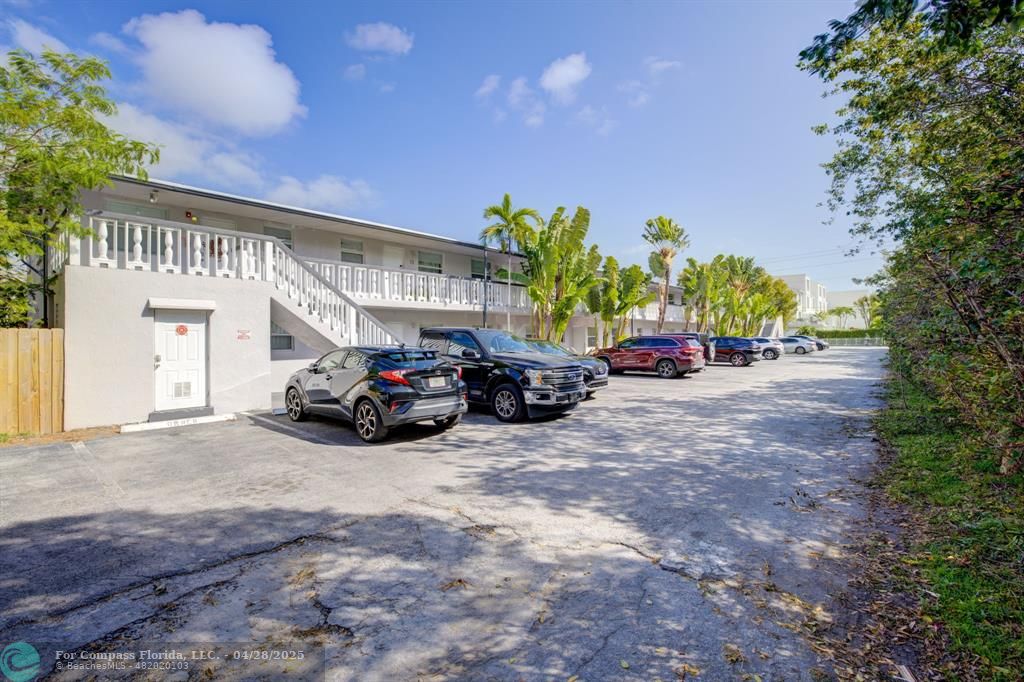 2741 Northeast 8th Avenue, Unit 15 Wilton Manors, FL 33334 - Photo 22 of 46 a view of car parked in front of a building