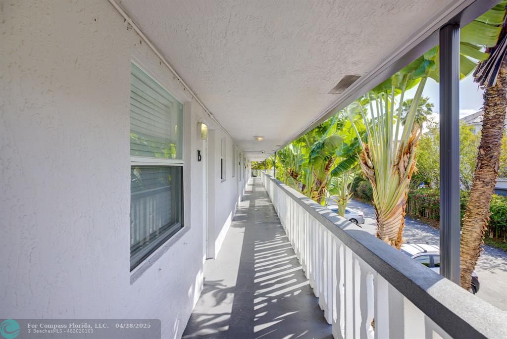 2741 Northeast 8th Avenue, Unit 15 Wilton Manors, FL 33334 - Photo 24 of 46 a view of balcony with wooden floor