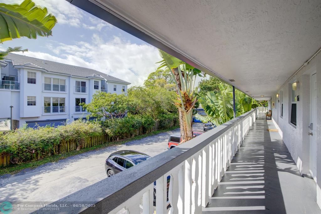 2741 Northeast 8th Avenue, Unit 15 Wilton Manors, FL 33334 - Photo 26 of 46 a view of a porch with furniture and garden