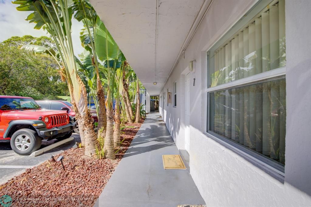 2741 Northeast 8th Avenue, Unit 15 Wilton Manors, FL 33334 - Photo 28 of 46 a view of a car parked in front of a building