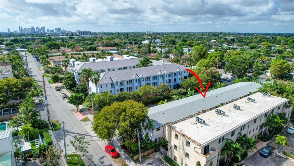 2741 Northeast 8th Avenue, Unit 15 Wilton Manors, FL 33334 - Photo 37 of 46 an aerial view of residential house with an outdoor space and seating
