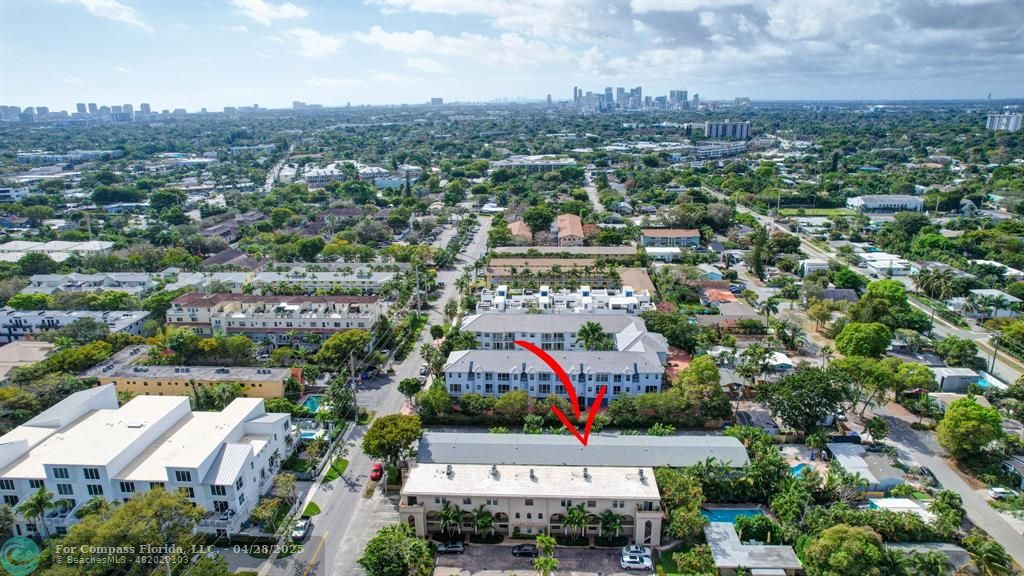 2741 Northeast 8th Avenue, Unit 15 Wilton Manors, FL 33334 - Photo 41 of 46 an aerial view of residential houses with city view