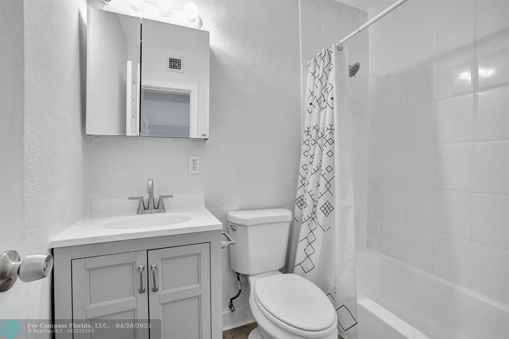 2741 Northeast 8th Avenue, Unit 15 Wilton Manors, FL 33334 - Photo 8 of 46 a bathroom with a sink a toilet and shower