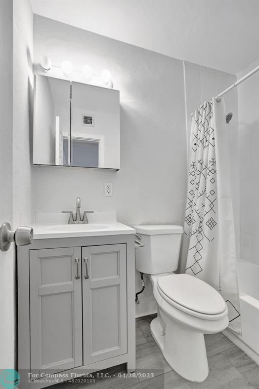 2741 Northeast 8th Avenue, Unit 15 Wilton Manors, FL 33334 - Photo 9 of 46 a bathroom with a sink toilet and shower