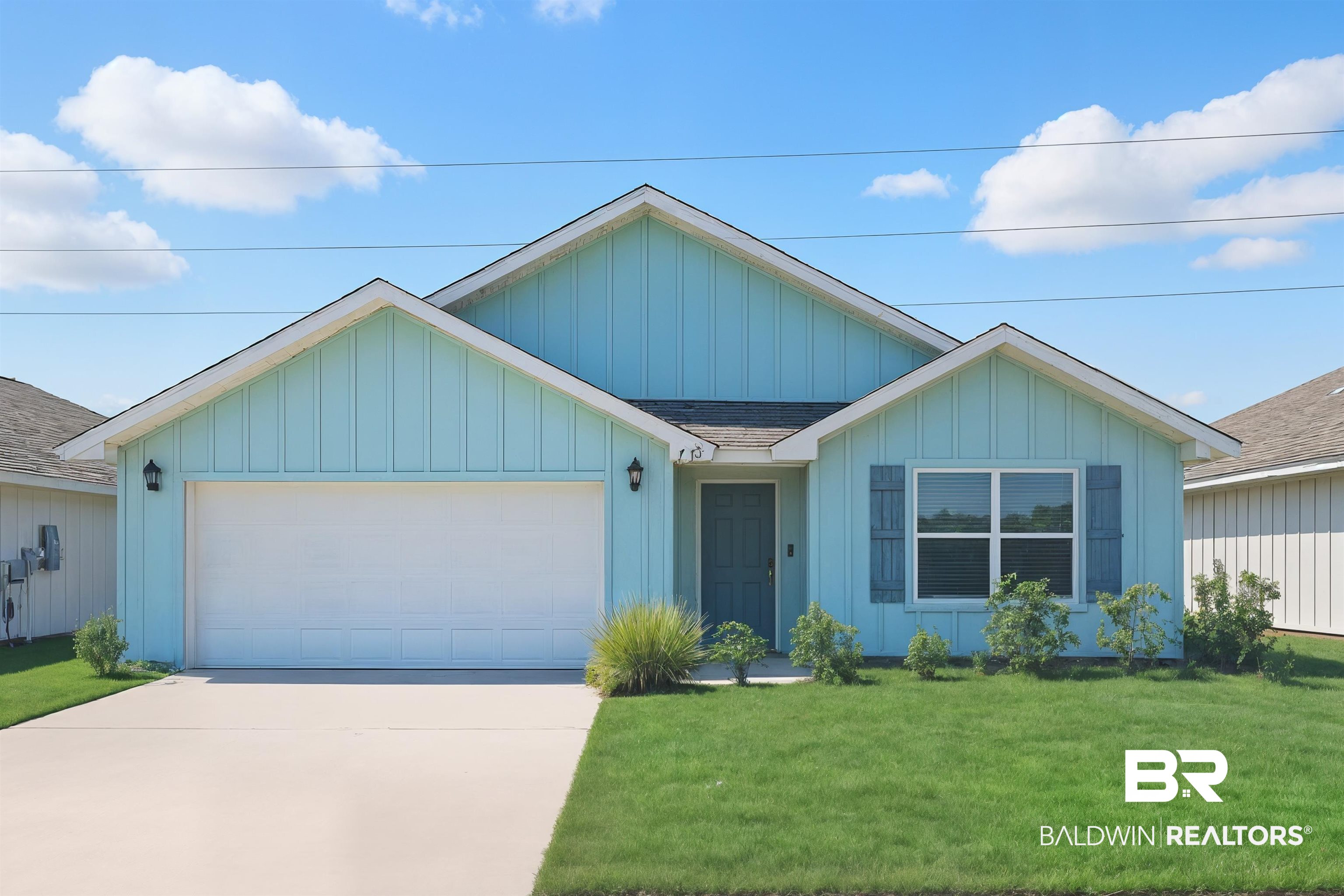 7429 Brompton Drive Foley, AL 36535 - Photo 1 of 50 View of front of property featuring an attached garage, board and batten siding, driveway, roof with shingles, and a front yard