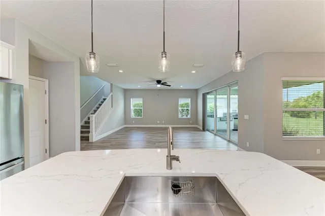 an aerial view of a house with garden space and street view