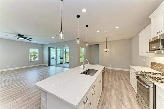 a view of a lake with a house in the background