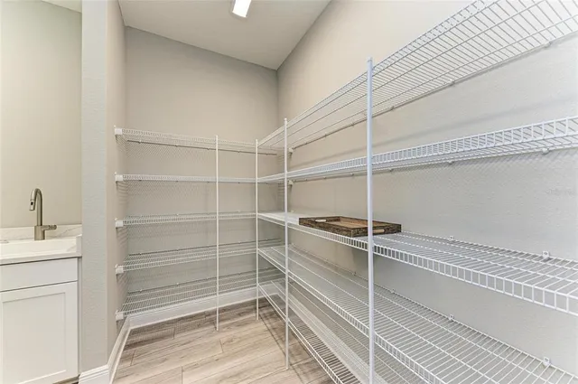 a view of swimming pool with outdoor seating and plants