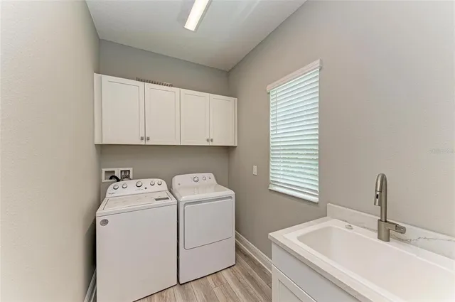 a view of a room with gym equipment and a large window