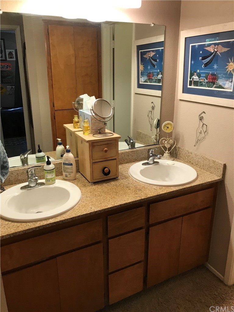 2055 Amanda Way, Unit 19 Chico, CA 95928 - Photo 7 of 15 a bathroom with double vanity sinks and a mirror